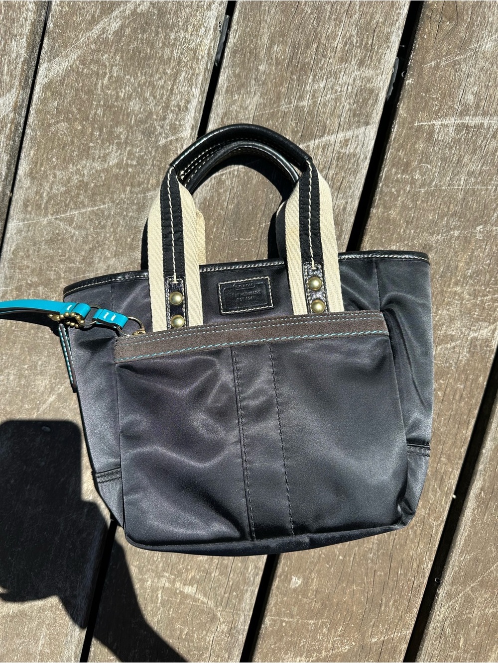 Coach Black Mini Tote with Cream Striped Handles and Teal Accent